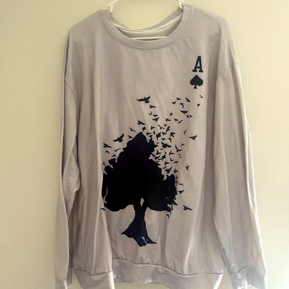 Selling white long-sleeve shirt with a ACE on top.